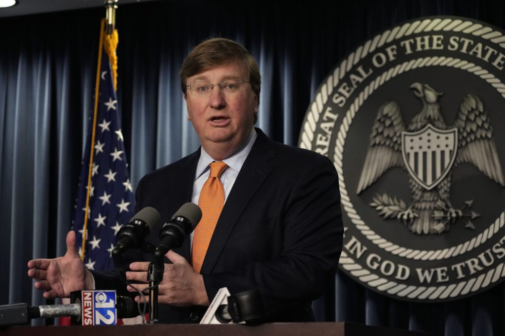 Mississippi Republican Gov. Tate Reeves answers a reporter's question on his announcement of a tech company expected to invest $10 billion to build two data processing centers that will create 1,000 jobs in central Mississippi, during a Wednesday, Jan. 24, 2024, news conference in Jackson, Miss. (AP Photo/Rogelio V. Solis)