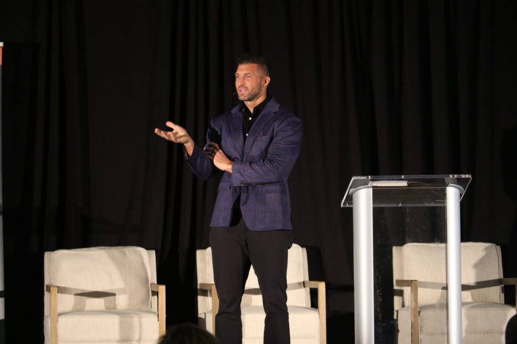 Heisman Trophy winner Tim Tebow speaks at the fifth annual Empower Mississippi Solutions Summit. During his presentation he spoke about faith, family and the importance of individualized support to children. (Photo by Jeremy Pittari | Magnolia Tribune)