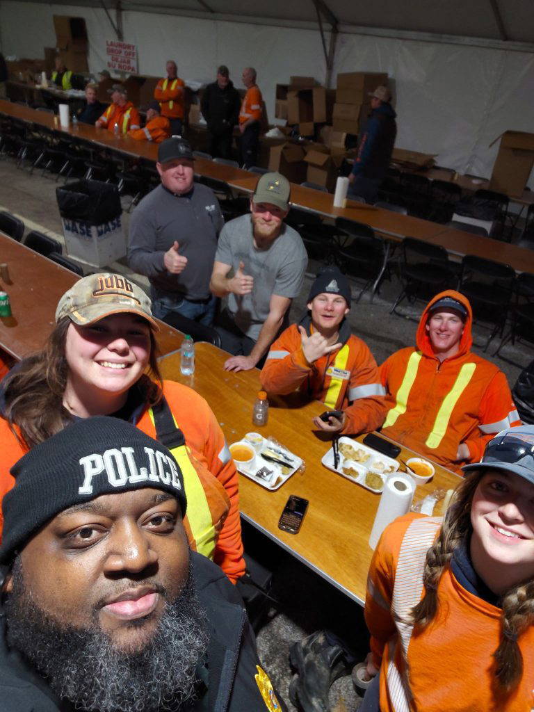 American and Canadian linemen share a meal with DSU Police after maintaining safety, security and power throughout campus and the local community for DSU students, faculty and staff.