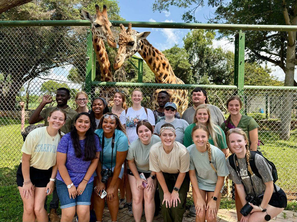 Faculty and students of Mississippi State’s College of Veterinary Medicine and Uganda’s Makerere University pose with giraffes. MSU students and professors spend a month each summer in Uganda, experiencing the philosophy and application of One Health, an interdisciplinary and scientifically holistic field promoting collaboration across medicine, veterinary science, environmental science and other areas to better detect, prevent and respond to health threats on a local and global scale. MSU will offer One Health graduate programming beginning this fall for professionals looking to expand their knowledge and skillsets. (Photo submitted)