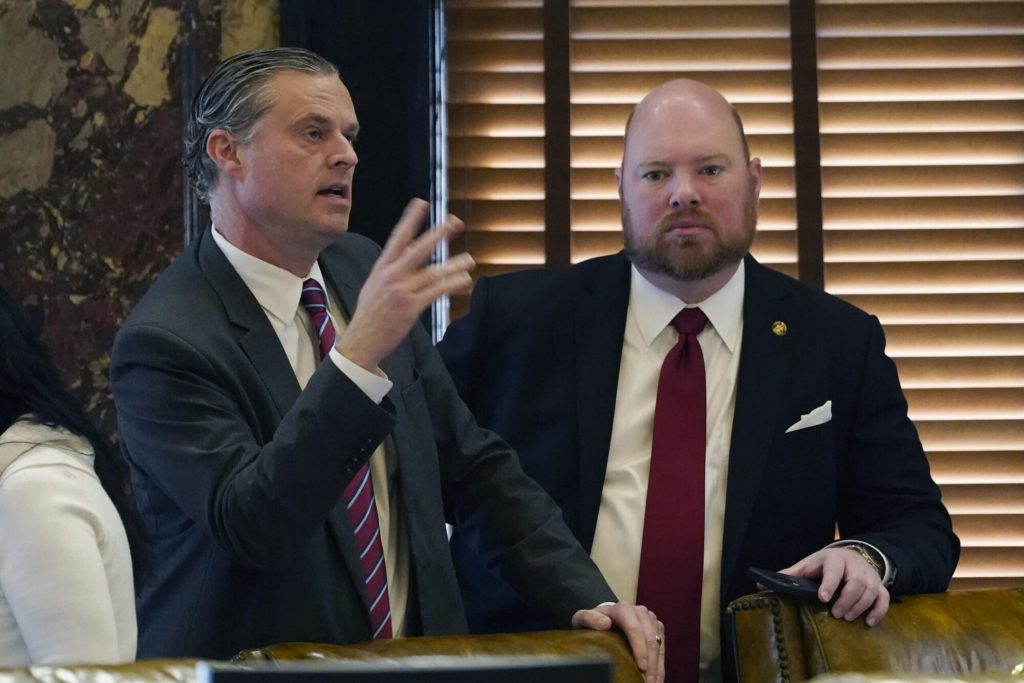 Republican Sens. Chad McMahan, left, of Guntown, and Joel Carter of Gulfport, confer during the morning session of the Mississippi Legislature in Jackson, Thursday, Jan. 19, 2023. (AP Photo/Rogelio V. Solis - Copyright 2023 The Associated Press. All rights reserved.)