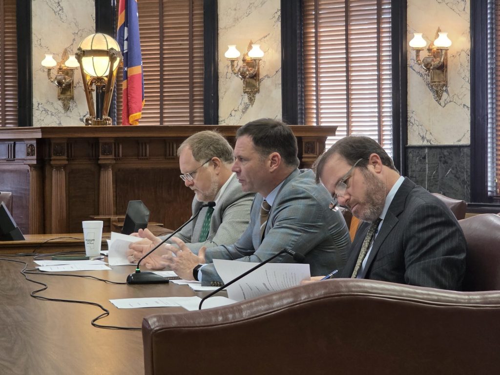 At center, State Senator ChrisJohnson describes the USM property sale. (Photo by Jeremy Pittari | Magnolia Tribune)