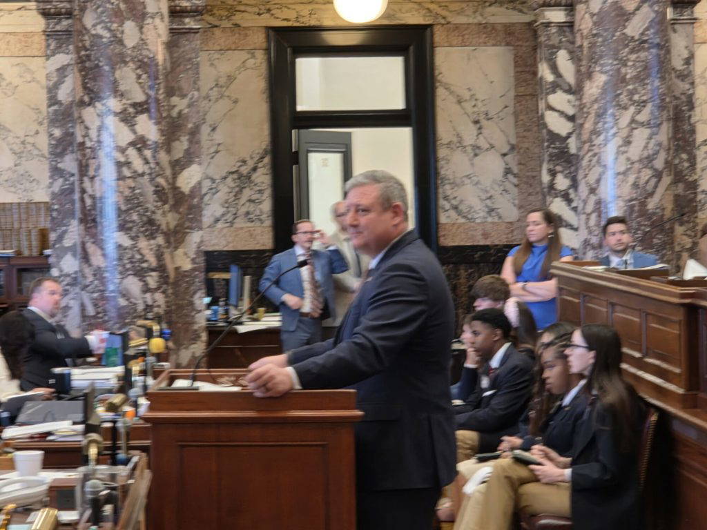 Senator Dennis DeBar (R) presents his amendment to a strike-all of HB 1395, which proposes teacher pay raises over the next three years. Photo by Jeremy Pittari | Magnolia Tribune