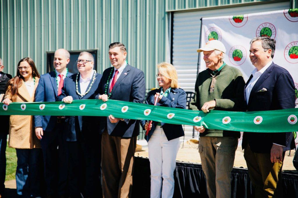 Commissioner of Agriculture and Commerce Andy Gipson assisted with cutting the ribbon at the Salad Days Hydroponic Farm facility in Flora. Salad Days recently completed a new 68,000-square-foot greenhouse facility, which will produce up to three million heads of lettuce annually.