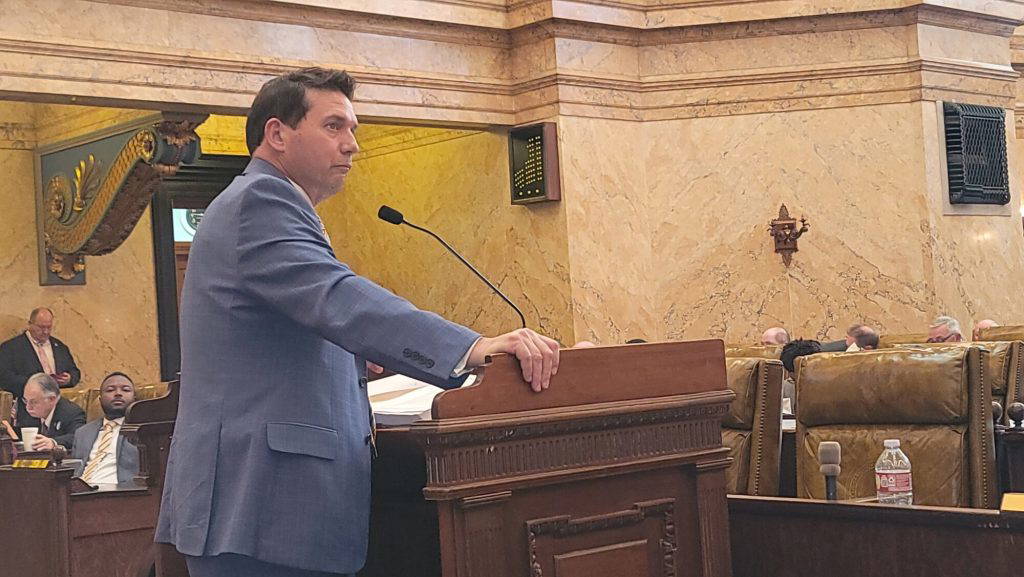 State Representative Lee Yancey presents in the well of the House, Wednesday, March 14, 2024. (Photo by Jeremy Pittari | Magnolia Tribune)