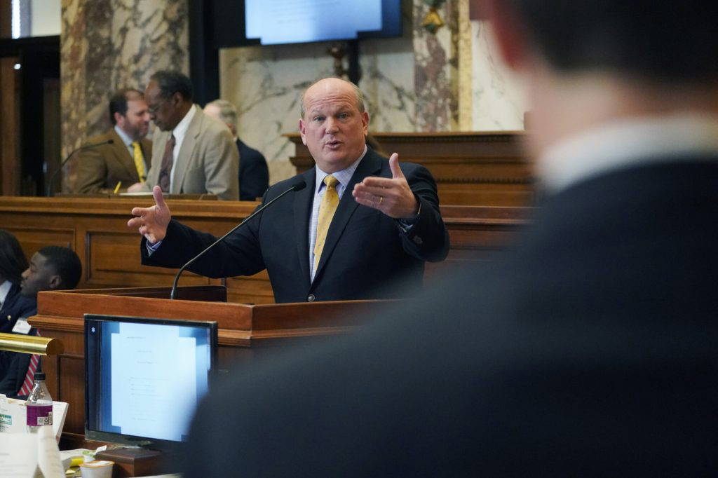 Sen. Brice Wiggins, R-Pascagoula, left, answers a question from Sen. Briggs Hopson, R-Vicksburg in the Senate Chamber, as lawmakers consider bills on their calendar, Friday, Feb. 3, 2023, at the Mississippi Capitol in Jackson. (AP Photo/Rogelio V. Solis)