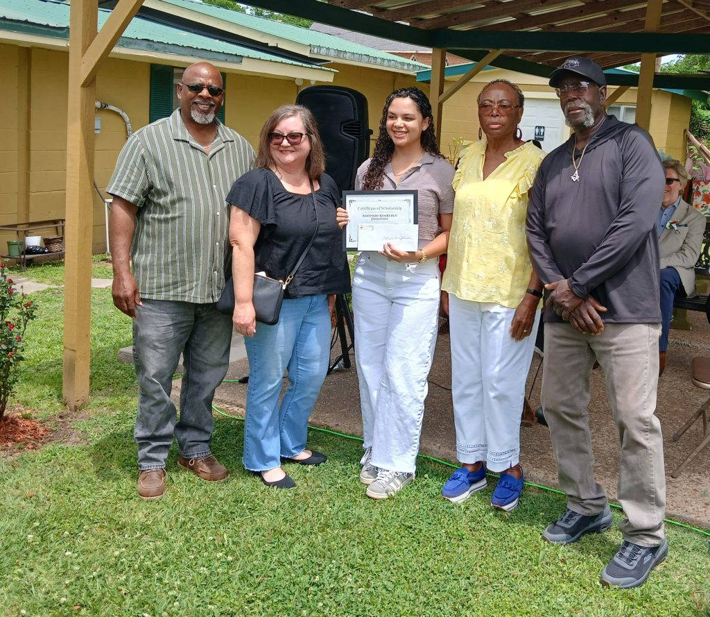 Addison Kimberly Johnson (center), the 2026 recipient of the $1,000 scholarship from the Rhythm Night Club Memorial Museum, holds her certificate following the presentation on Saturday, April 25, 2026. Pictured with her are her parents, Kim Johnson (left) and Amy Johnson (second from left), and museum co-owners Betty Sago and Monroe Sago. Photo by Roscoe Barnes III