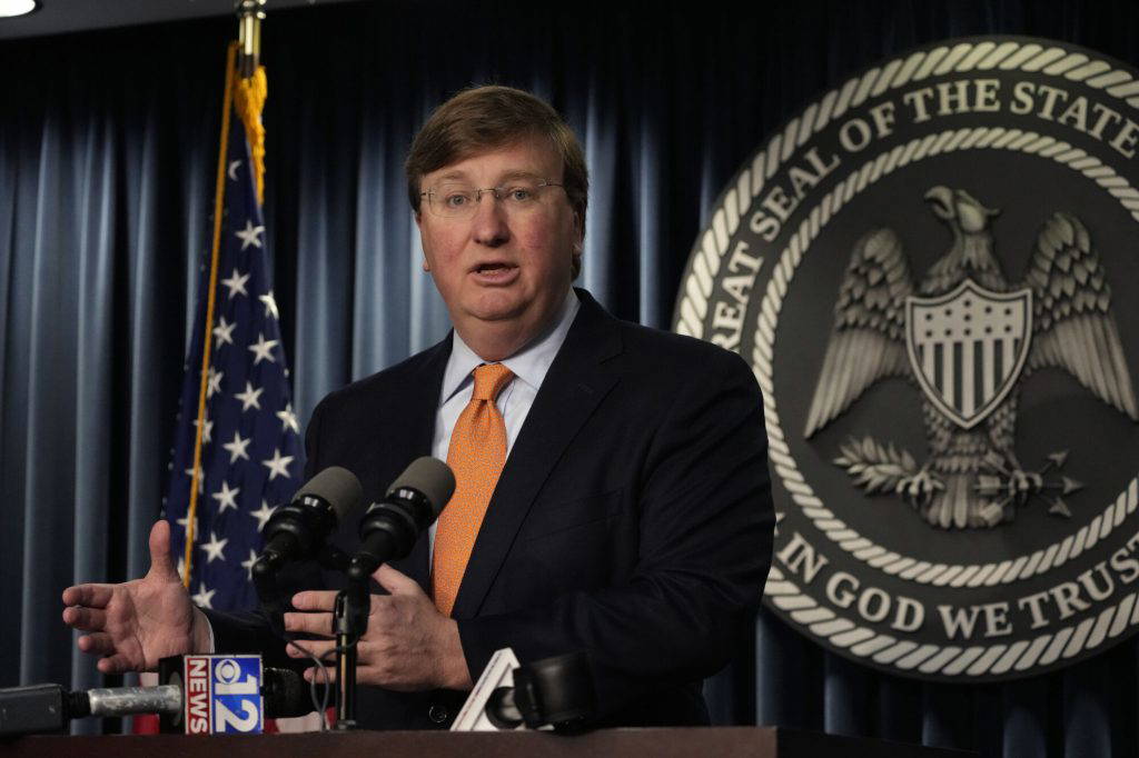 Mississippi Republican Gov. Tate Reeves answers a reporter's question on his announcement of a tech company expected to invest $10 billion to build two data processing centers that will create 1,000 jobs in central Mississippi, during a Wednesday, Jan. 24, 2024, news conference in Jackson, Miss. (AP Photo/Rogelio V. Solis)