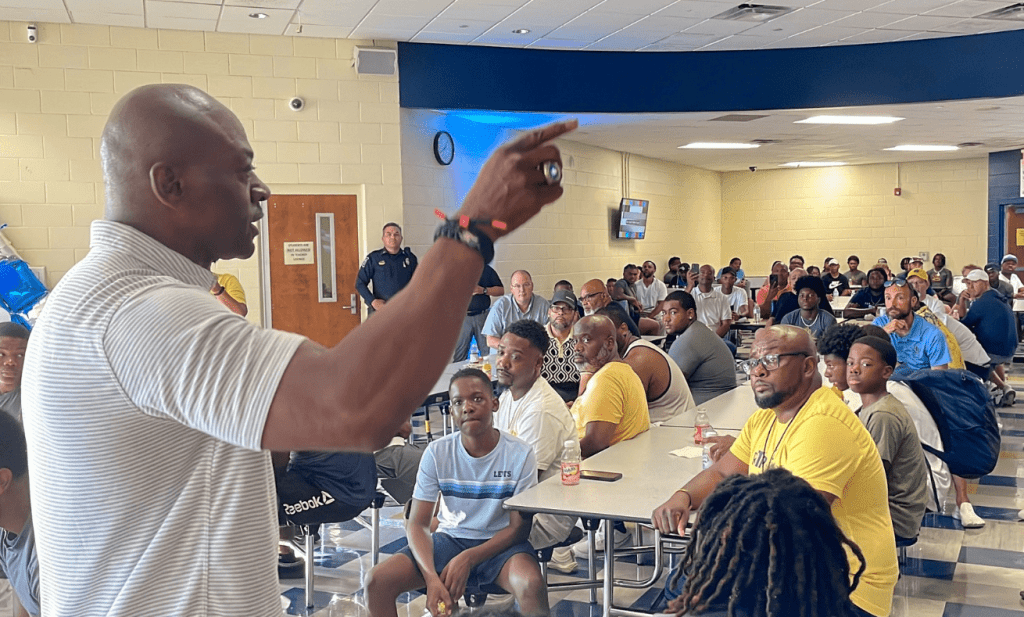 DeSoto County Sheriff Thomas Tuggle speaks at the Olive Branch football Doughnuts for Dads, August 2025 (Photo from Tuggle's Facebook page)