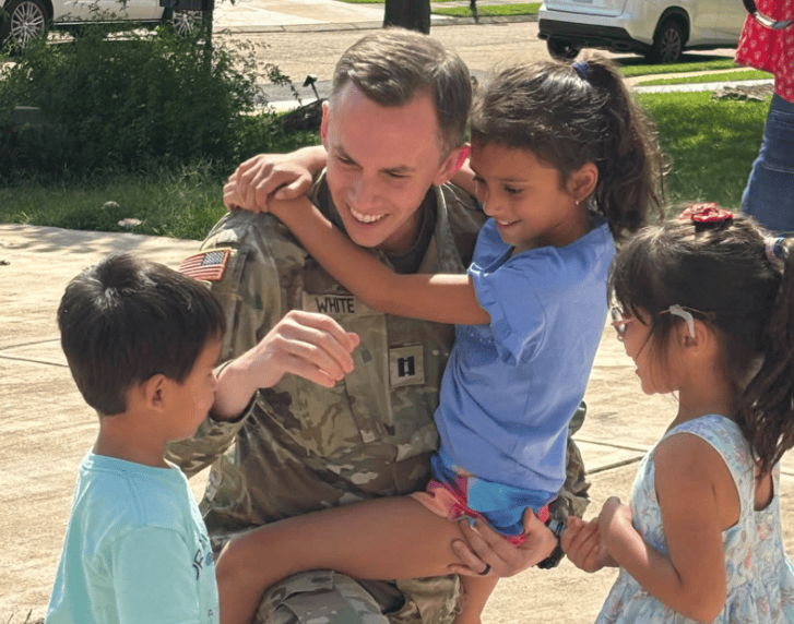 Shad White with his children after returning home from National Guard deployment, September 2026 (Photo from White's Facebook page)