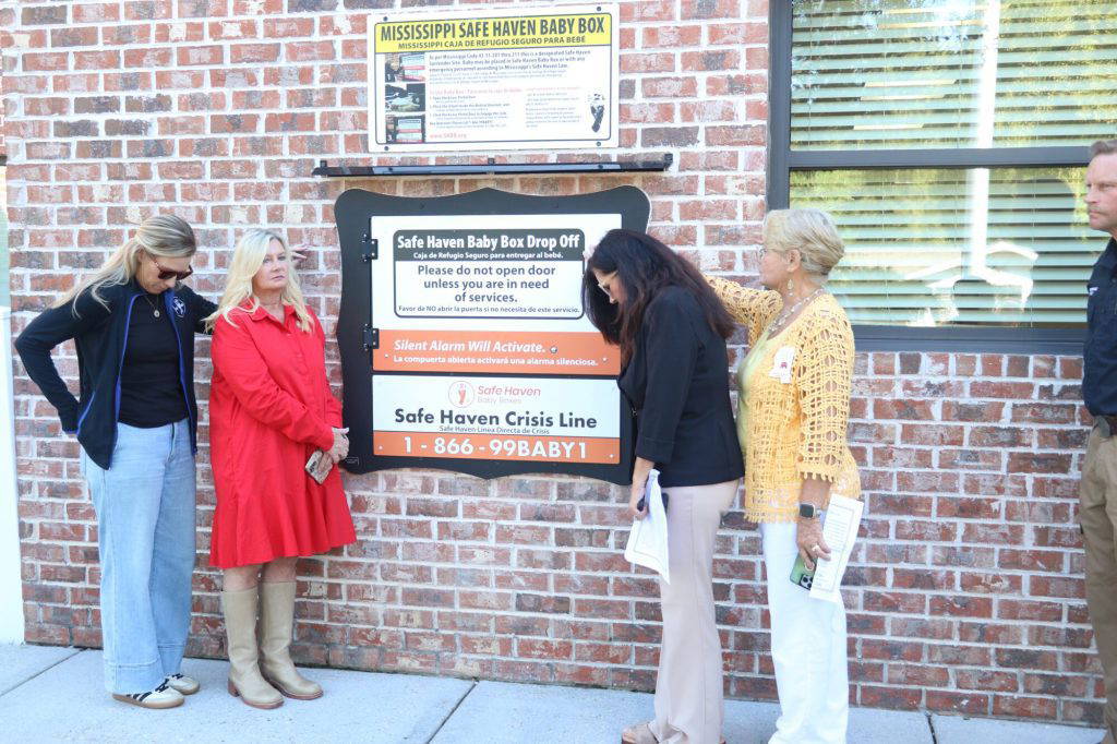 Picayune is now the 12 location of a Safe Haven Baby Box in the state of Mississippi. From left Caitlin Kelly, Rep. Stacey Hobgood-Wilkes, State Senator Angela Hill and Debbie Benoit stand next to the box during it's blessing on Wednesday. (Photo by Jeremy Pittari | Magnolia Tribune)